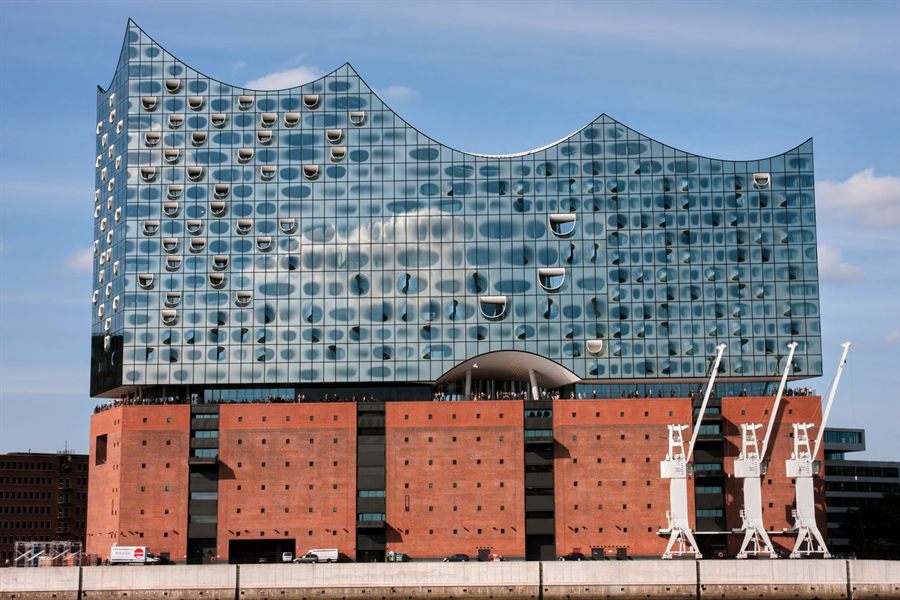 Elbphilharmonie concert hall rising above the old harbor warehouse in Hamburg