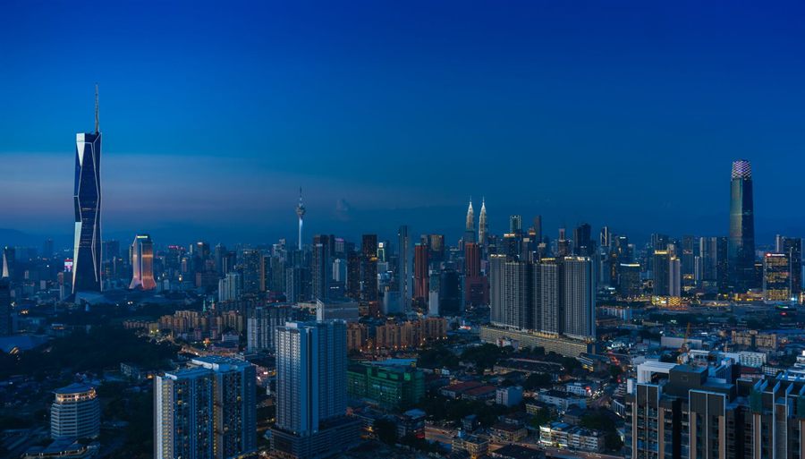 Kuala Lumpur skyline at dusk with city lights